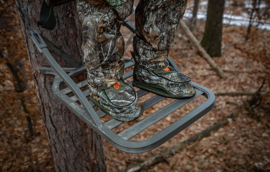 Closeup of the ArcticShield Boot Insulators being worn by a hunter in a tree stand while waiting for the perfect shot.